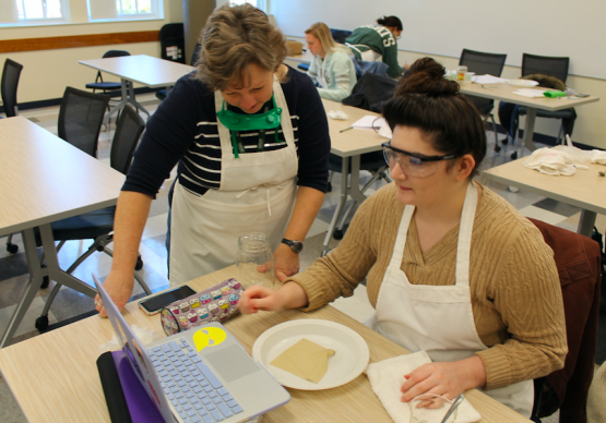 Lisa Williams helping student